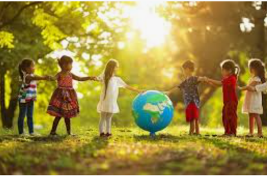 Children playing around a globe in a sunny park