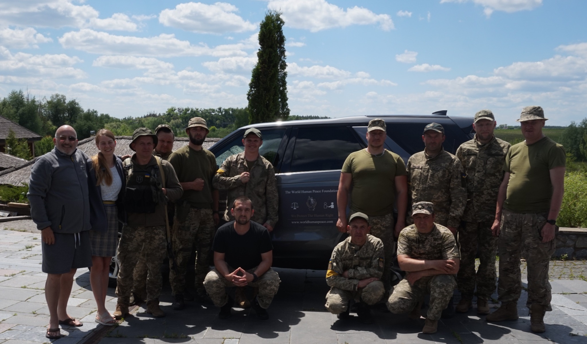 Francisco Armani and Veronika Bock with members of the team who protected them outside Kyiv