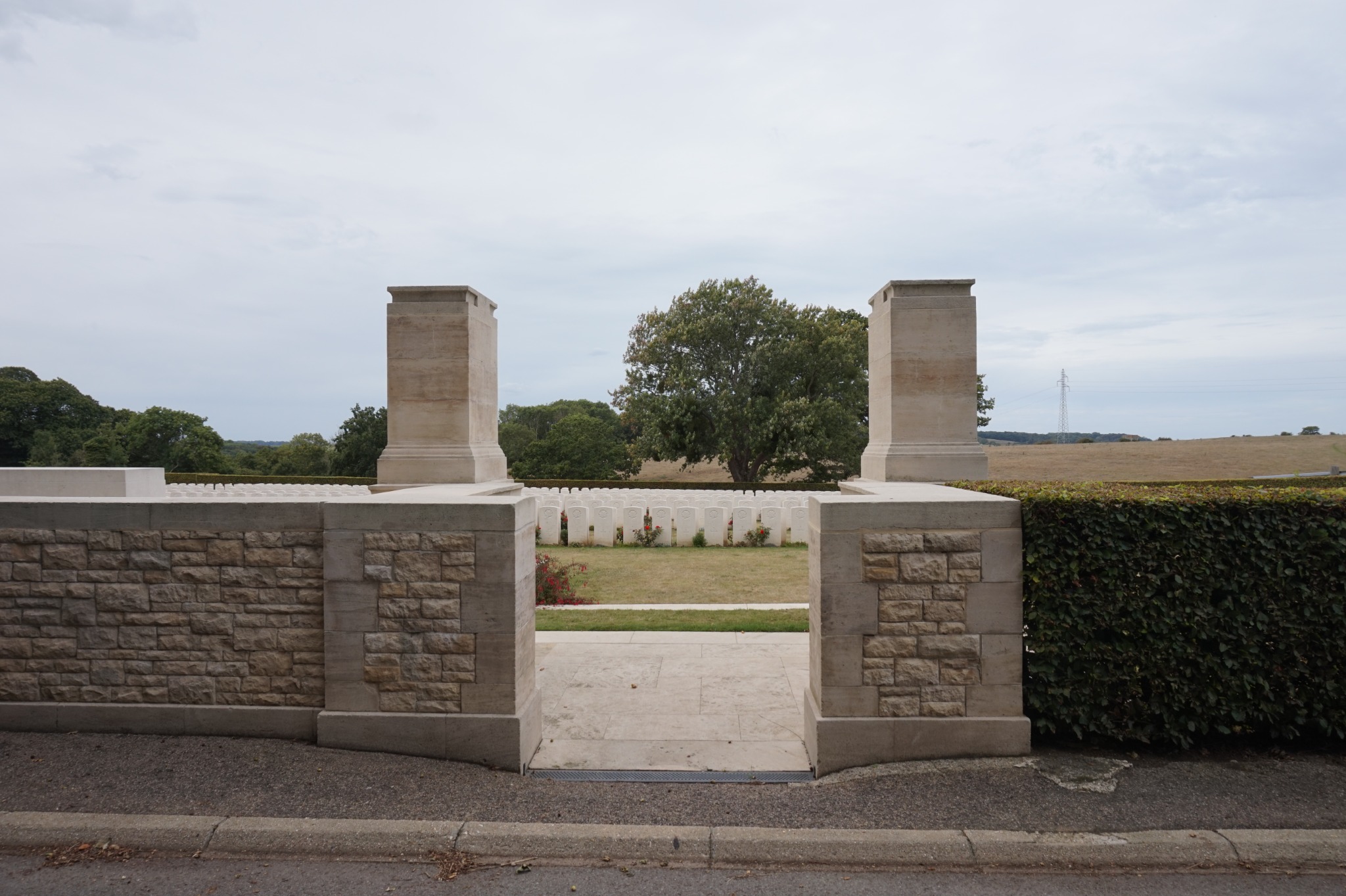 The cemetery entrance, opening onto rows of graves.